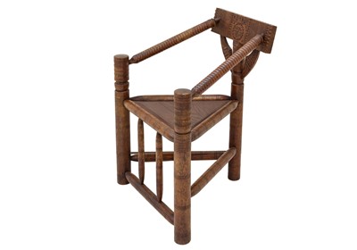 Lot 698 - A late Victorian oak turner's type elbow chair.