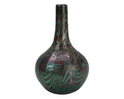 Lot 98 - An iridescent glass vase.