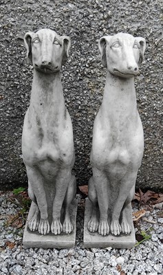 Lot 438 - A pair of cast concrete sculptures of seated whippets.