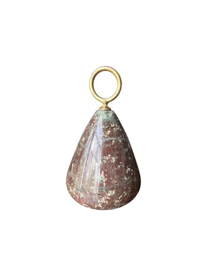Lot 63 - A Cornish red serpentine door stopper with brass loop handle.
