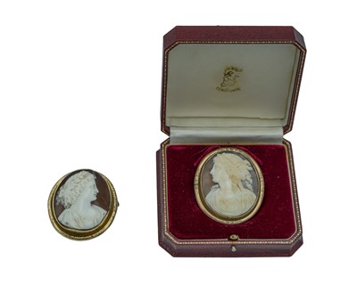 Lot 408 - Two gilt oval shell cameo brooches.