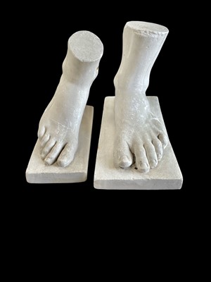 Lot 51 - Two cast plaster feet, looks to be a male and...