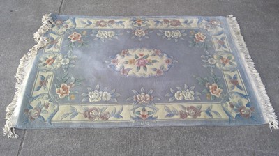 Lot 55 - A Chinese Carved Rug. 183cm by 122cm.