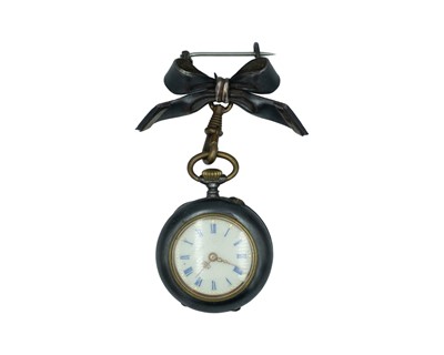 Lot 534 - A Swiss gun metal cylinder fob watch, with bow brooch, within original burgundy velvet travel case.