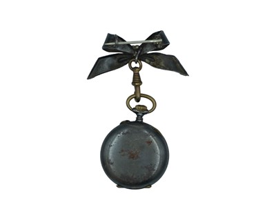 Lot 534 - A Swiss gun metal cylinder fob watch, with bow brooch, within original burgundy velvet travel case.