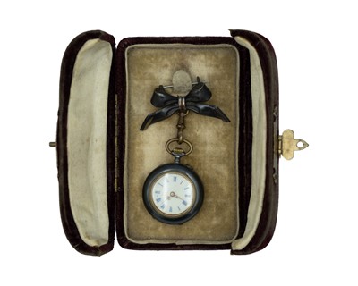 Lot 534 - A Swiss gun metal cylinder fob watch, with bow brooch, within original burgundy velvet travel case.