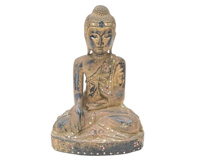 Lot 358 - A carved, gilded and black lacquered soft wood figure of Buddha.