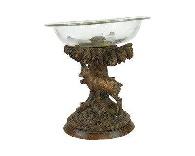 Lot 57 - A Black Forest softwood and glass tazza.