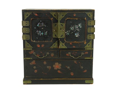 Lot 376 - A Japanese black lacquer table cabinet.