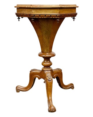 Lot 884 - A Victorian walnut and inlaid sewing table.