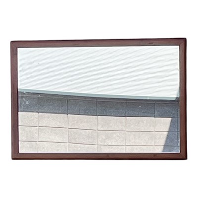 Lot 130 - A wooden-framed wall mirror.