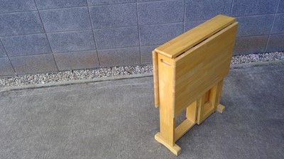 Lot 145 - A Rubberwood gateleg table, 76cm tall, 61cm...