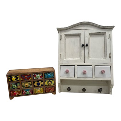 Lot 147 - A hand-painted ceramic drawer unit, made in...