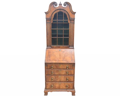 Lot 881 - A Queen Anne style walnut bureau bookcase.