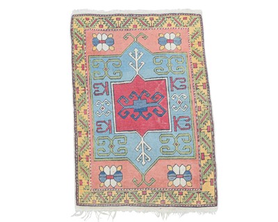 Lot 398 - A Kazak wool rug.
