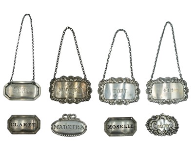 Lot 112 - A selection of silver decanter labels.