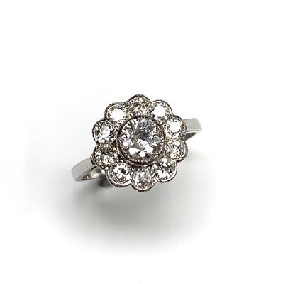 Lot 2432 - A very pretty diamond cluster ring with bright...