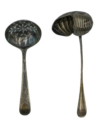Lot 294 - A silver nautilus shell-shaped tea strainer by George Bowen & Sons.