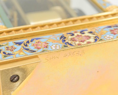 Lot 770 - A French champleve enamel grande sonnerie repeating carriage alarm clock.