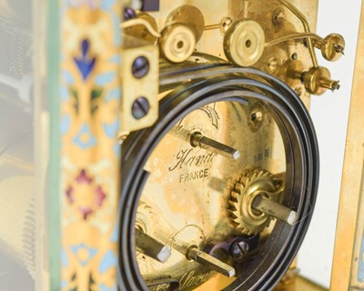 Lot 770 - A French champleve enamel grande sonnerie repeating carriage alarm clock.