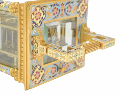 Lot 770 - A French champleve enamel grande sonnerie repeating carriage alarm clock.