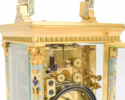 Lot 770 - A French champleve enamel grande sonnerie repeating carriage alarm clock.