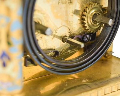 Lot 770 - A French champleve enamel grande sonnerie repeating carriage alarm clock.