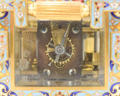 Lot 770 - A French champleve enamel grande sonnerie repeating carriage alarm clock.