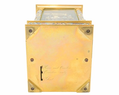 Lot 770 - A French champleve enamel grande sonnerie repeating carriage alarm clock.