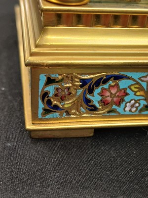 Lot 770 - A French champleve enamel grande sonnerie repeating carriage alarm clock.