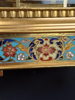 Lot 770 - A French champleve enamel grande sonnerie repeating carriage alarm clock.