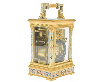 Lot 770 - A French champleve enamel grande sonnerie repeating carriage alarm clock.