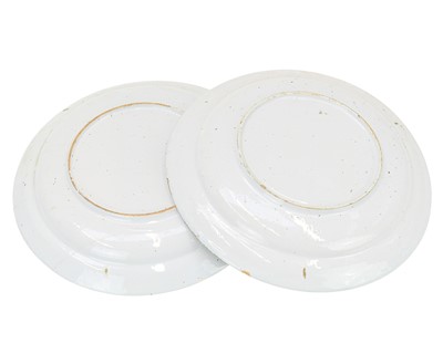 Lot 627 - A pair of English Delft polychrome chargers.