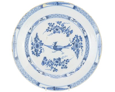 Lot 636 - An English Delft blue and white charger.