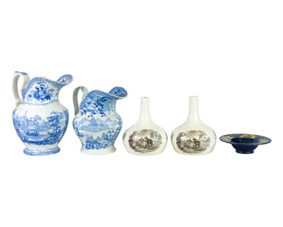 Lot 604 - Two early 19th century blue and white earthenware jugs.