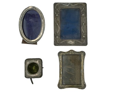 Lot 228 - A collection of four silver mounted picture frames.
