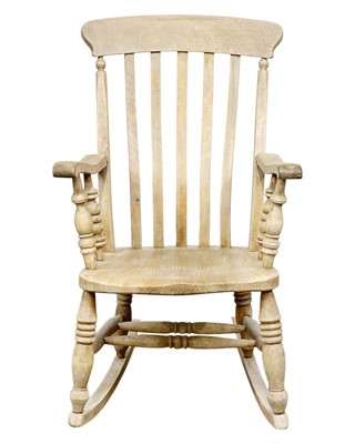 Lot 705 - A Beech lath back rocking Winsor chair.