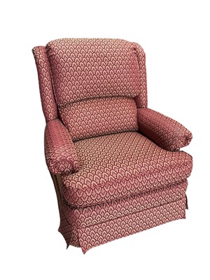 Lot 203 - A comfortable armchair with patterned...
