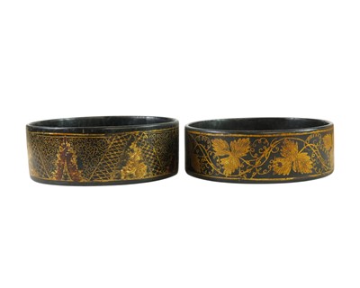 Lot 78 - Two George III black lacquered circular wine coasters.