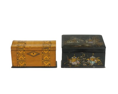 Lot 52 - A Victorian black lacquered slope top box.