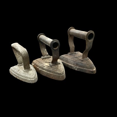 Lot 240 - Three flat irons.