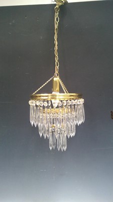 Lot 247 - A Brass and Glass Chandelier. The Chandelier...