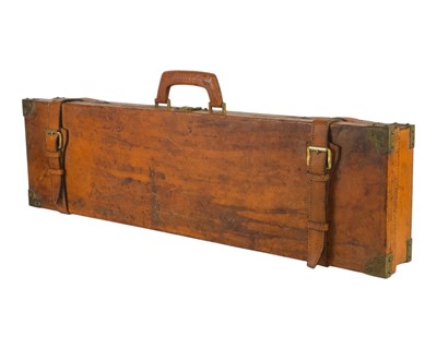 Lot 212 - A leather covered shotgun case.