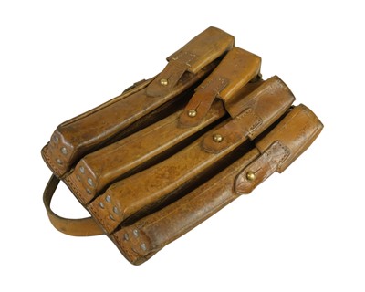 Lot 216 - A military leather four pouch magazine holder.