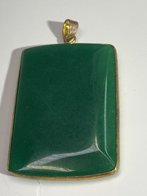 Lot 2455 - A jade pendant 55 x 37mm