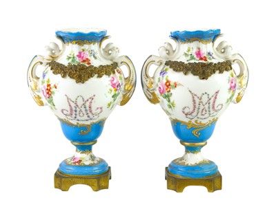 Lot 555 - A pair of 'Sevres' porcelain 'Marie Antoinette' ormolu mounted vases.