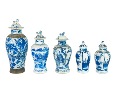 Lot 374 - A small pair of Chinese blue and white vases and covers.