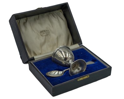 Lot 293 - A silver egg cup and spoon by Wolfsky & Co Ltd.