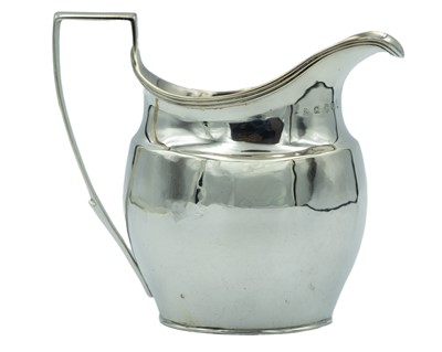Lot 236 - A George III silver helmet-shaped milk jug.