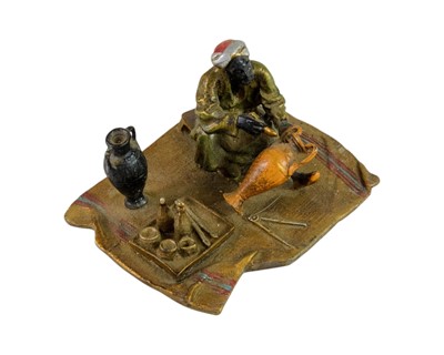 Lot 3 - A cold painted bronze figure of an Arab trader.